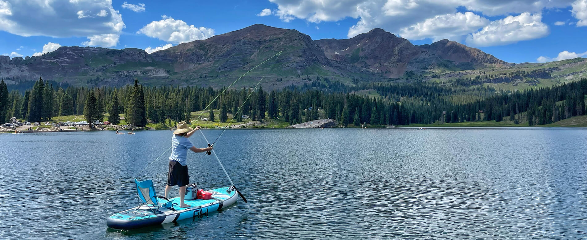 Man fishing on a large sup