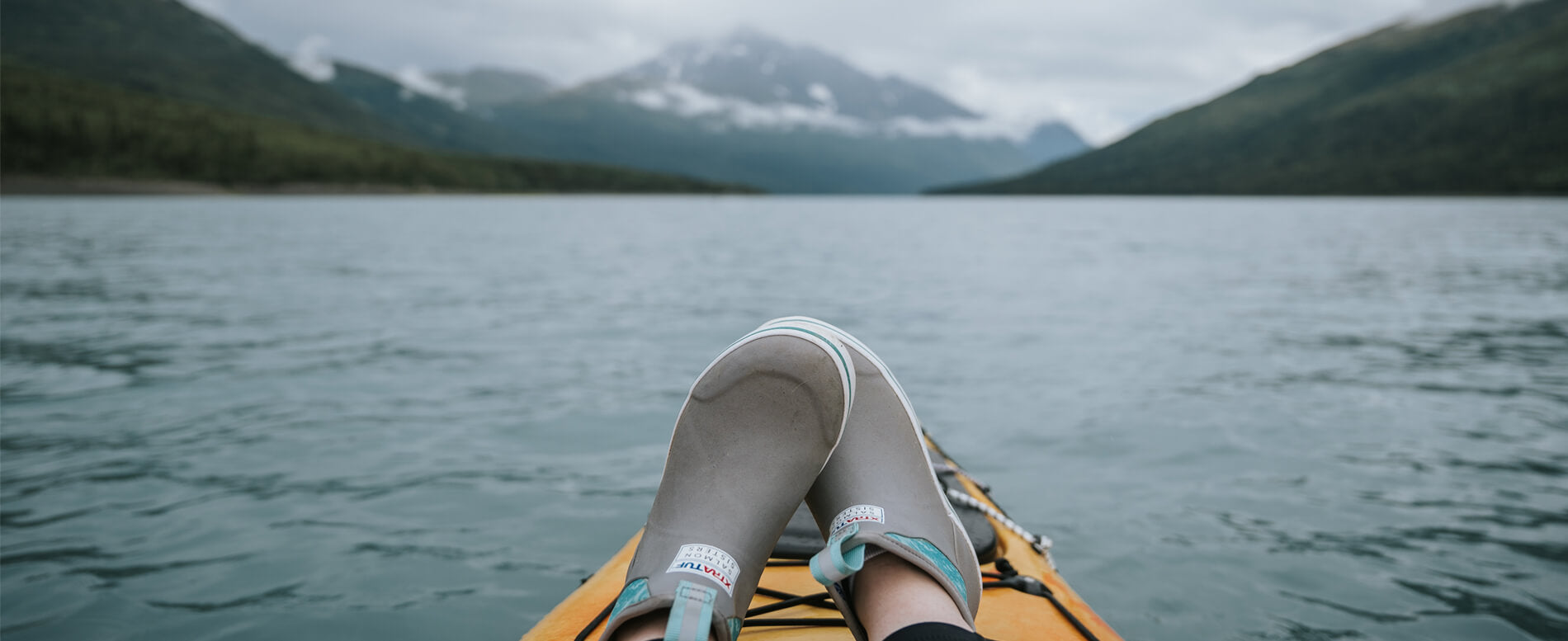 Man paddle boarding in Alaska