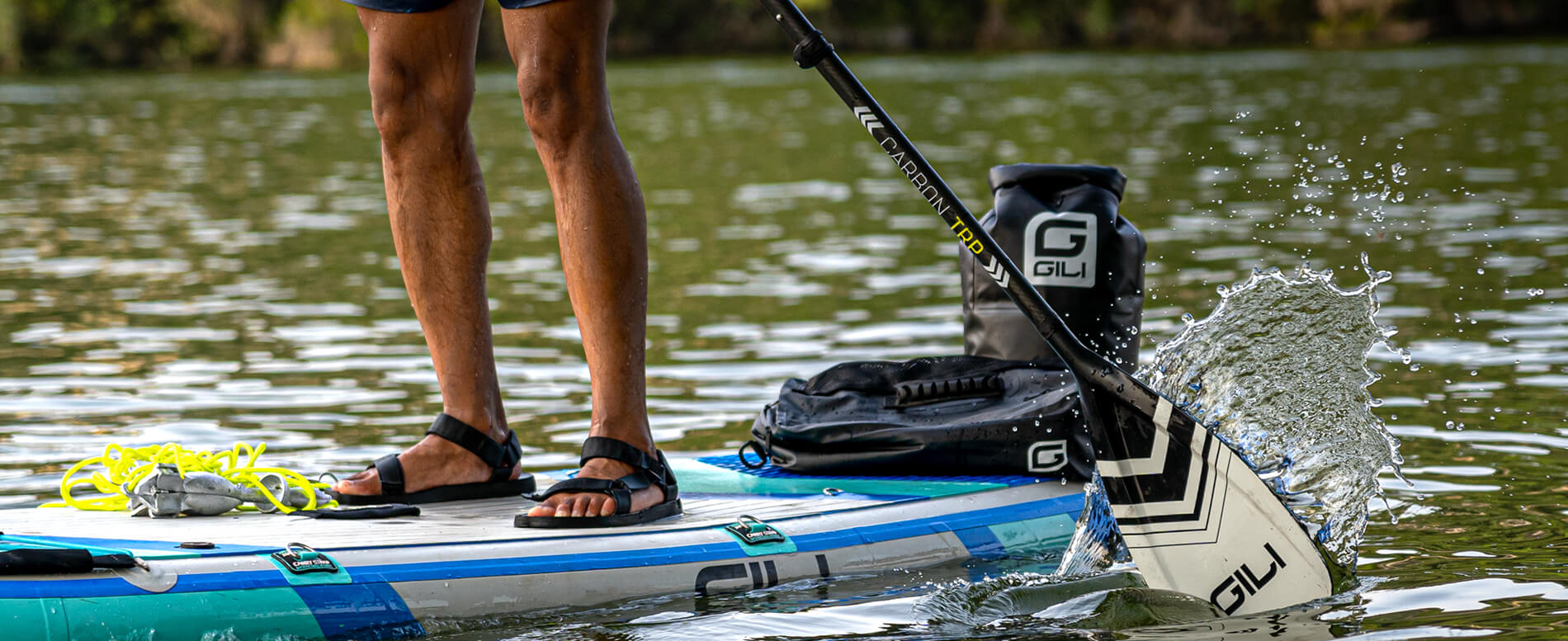 Man paddle boarding with accessories