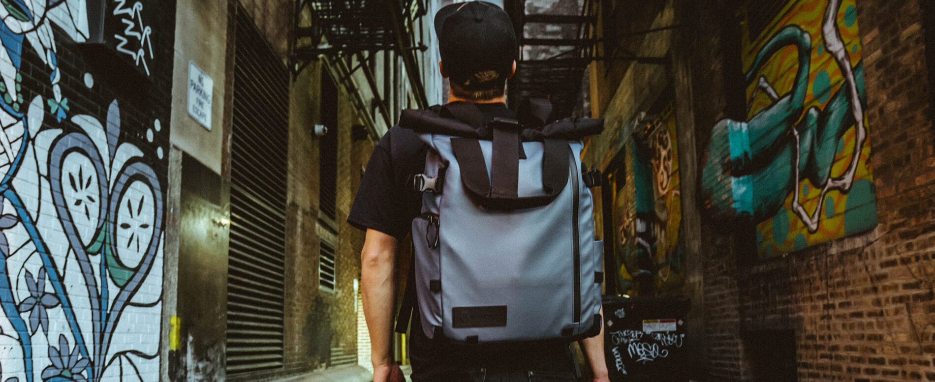 Man walking with a waterproof cooler backpack