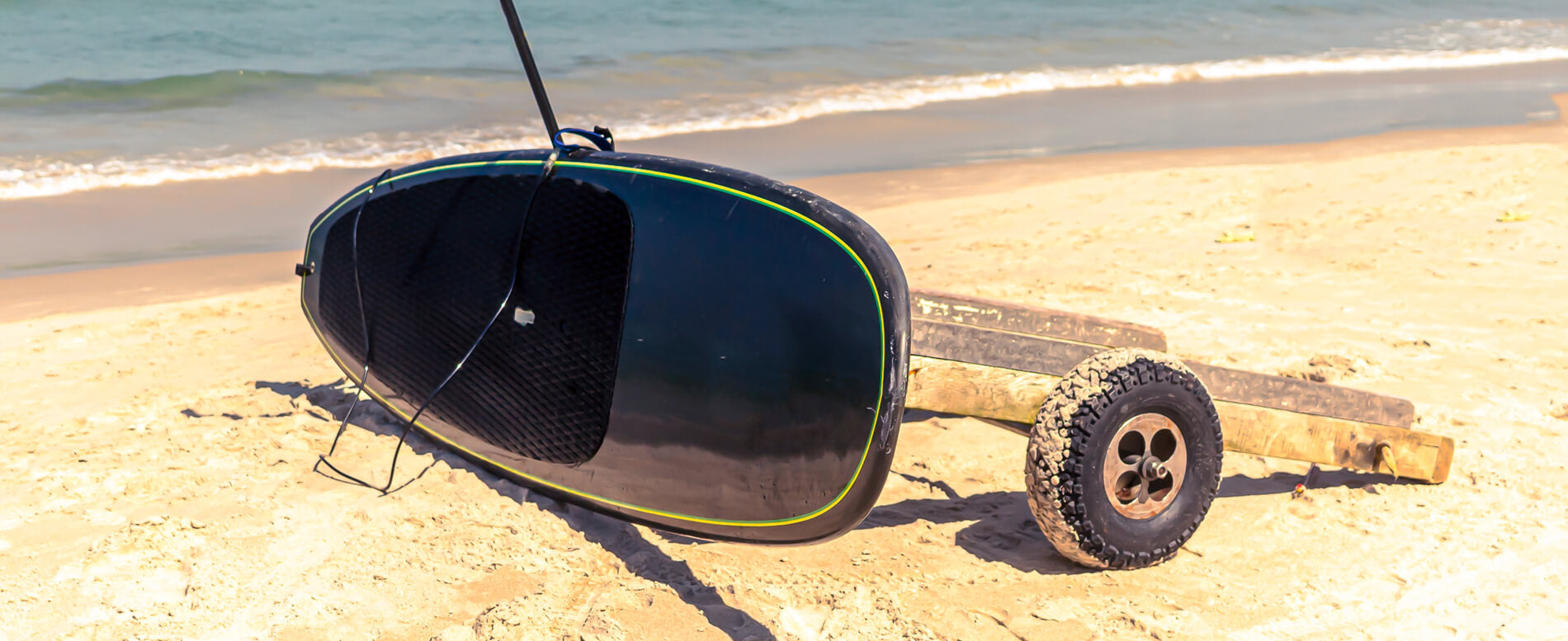 Paddle board on a beach cart